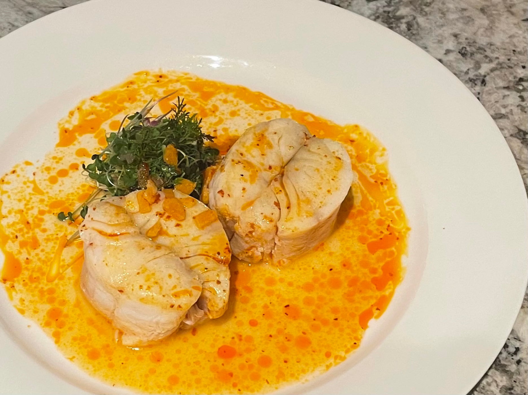 Private chef chicken entree with a golden cream sauce